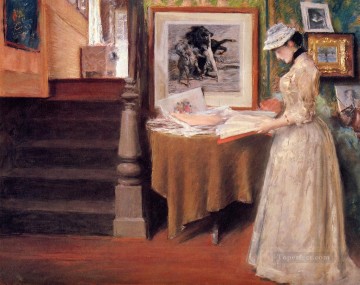 Interior Mujer joven en una mesa William Merritt Chase Pinturas al óleo